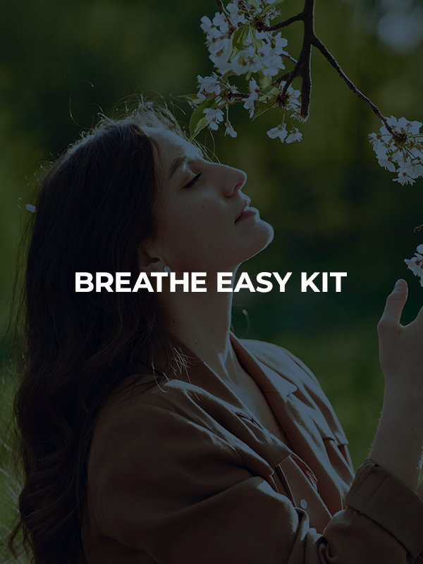 Symbolic photo for the Breathe Easy Kit: woman smelling a flower outdoors, representing seasonal allergy relief.