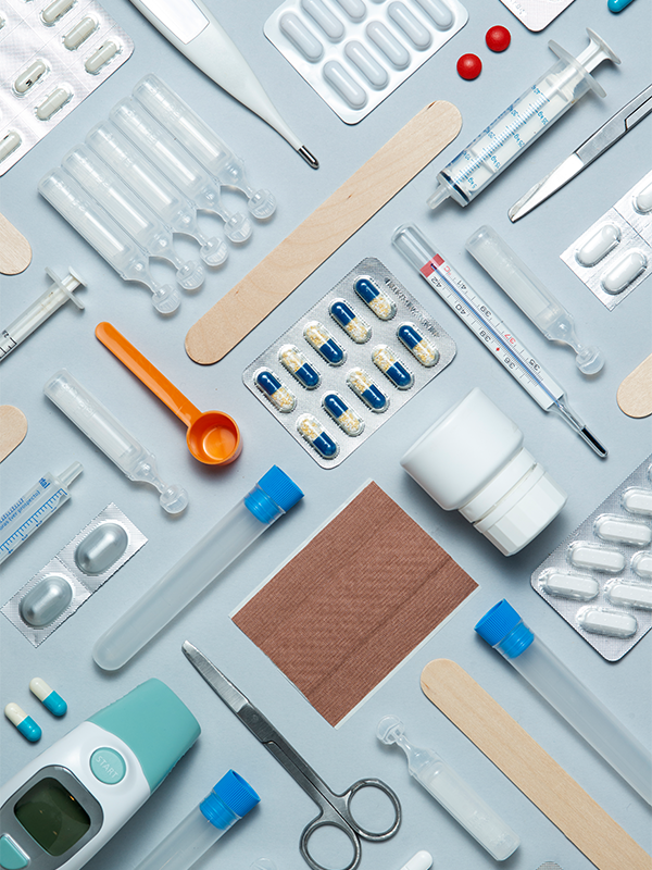 Various medications laid out on a surface, reflecting the Comprehensive Kit’s readiness for multiple health concerns