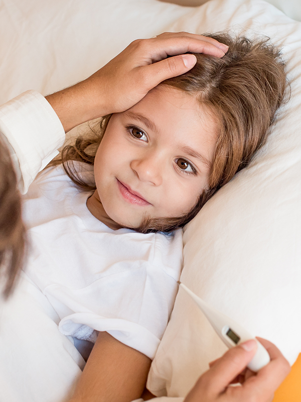 Parent comforting a child, reflecting the KIDS KIT and its essential medications for children’s care.